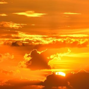 photo of bright yellow and orange sunrise