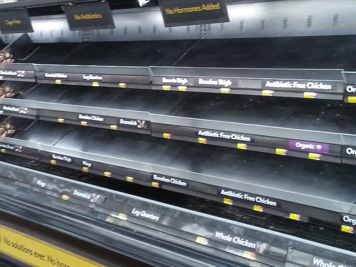 A row of empty grocery shelves during the winter storm in Texas.
